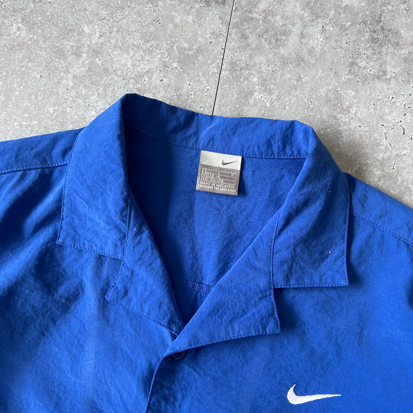 vintage y2k Nike Blue Button-Up Shirt with Graphic Hem
