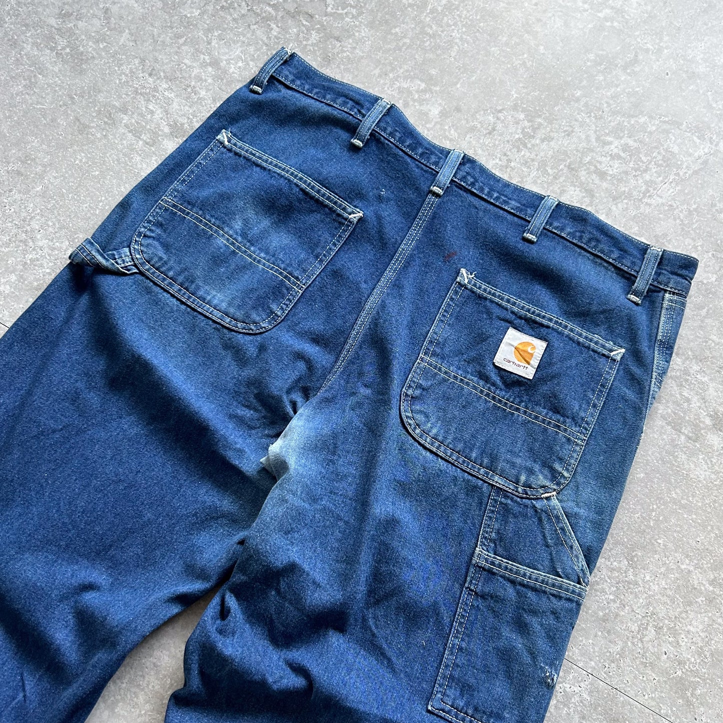 1990s - vintage dark wash carhartt denim carpenter trousers