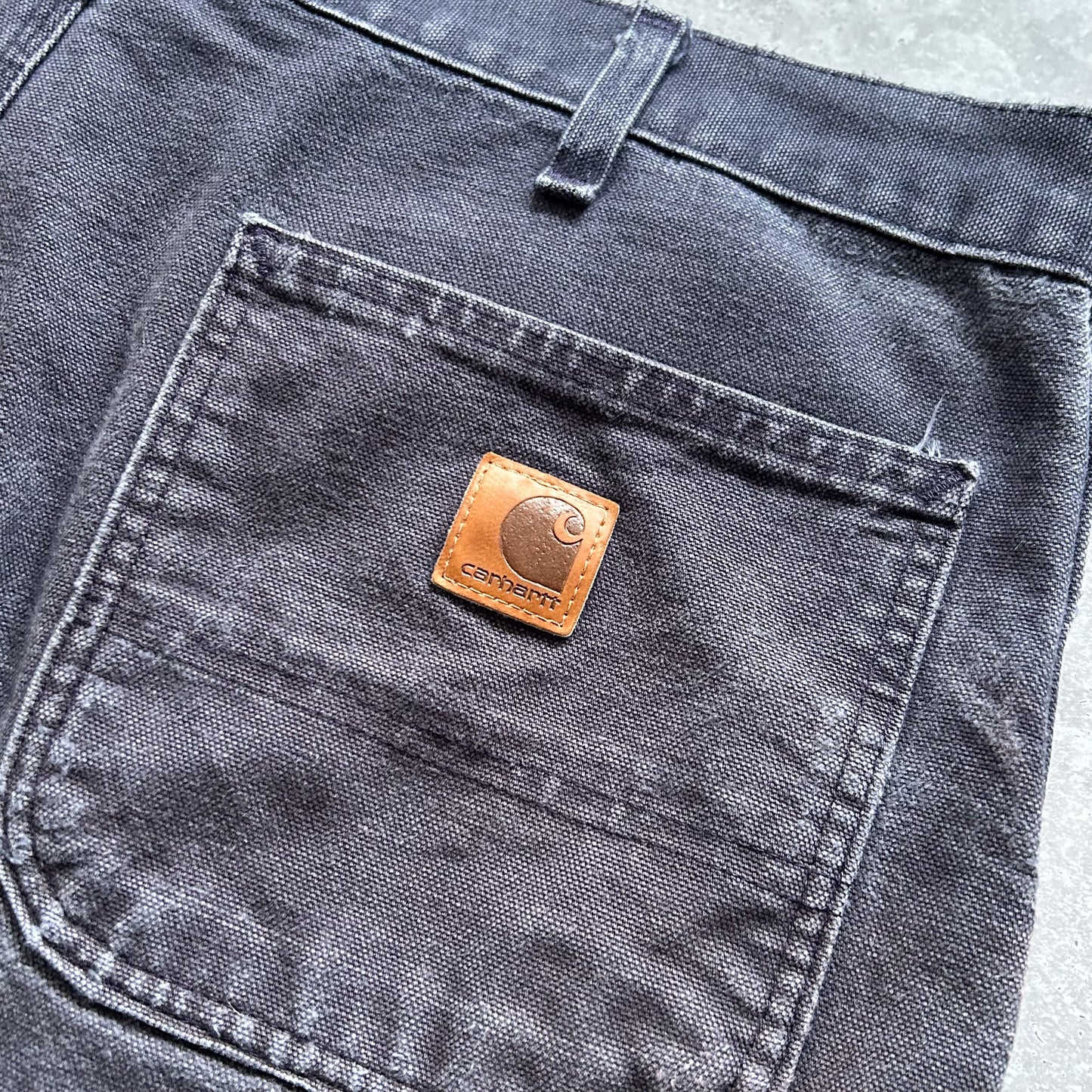 1990s - vintage faded navy worn carhartt carpenter trousers