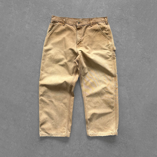 1990s - vintage faded cream carhartt single knee carpenter trousers