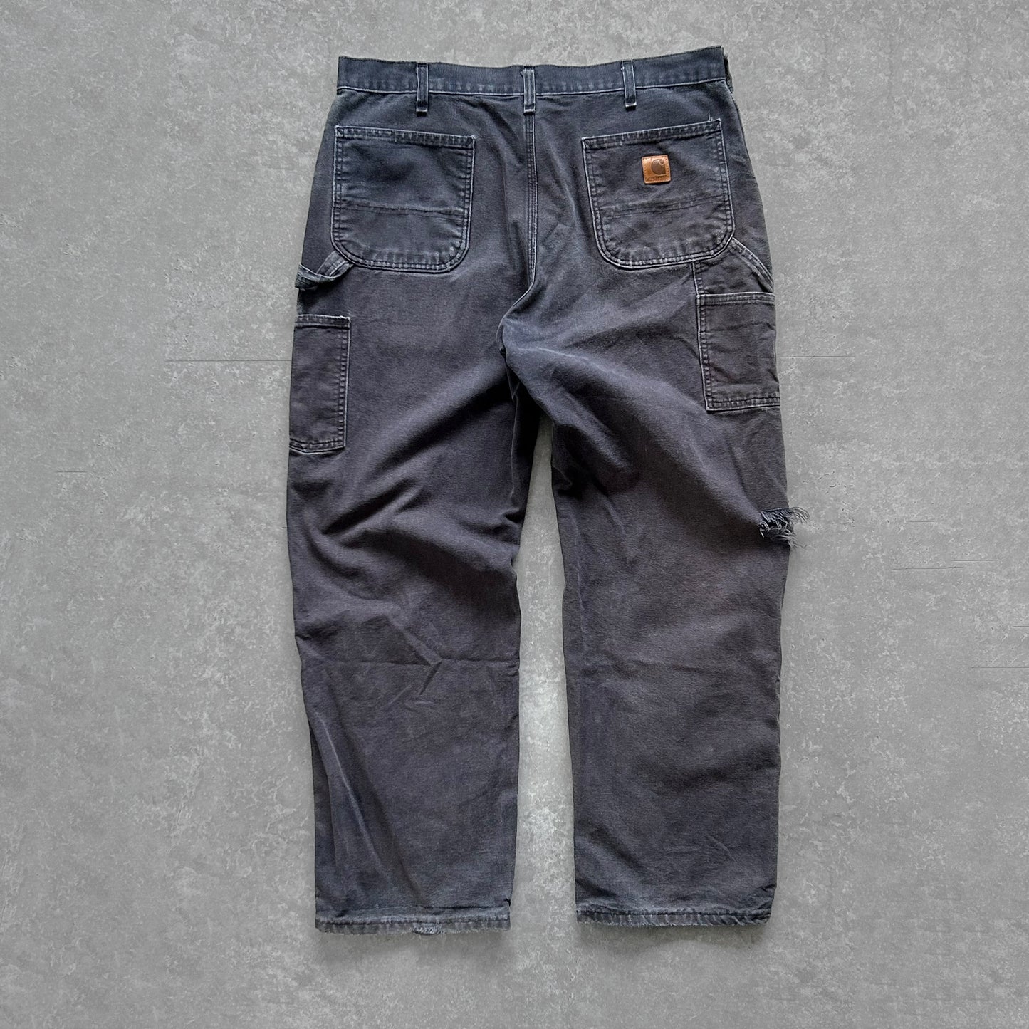 1990s - vintage faded navy worn carhartt carpenter trousers