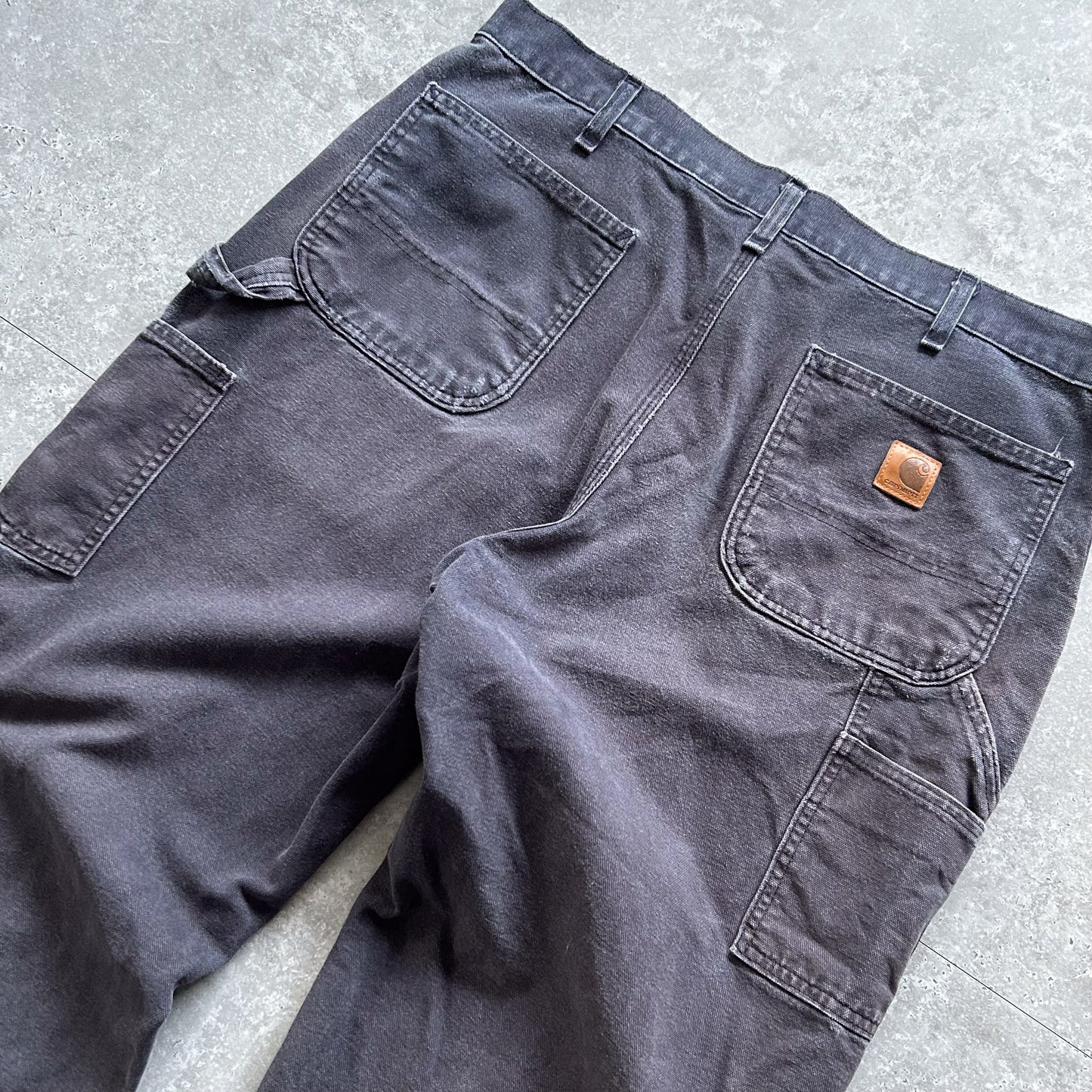 1990s - vintage faded navy worn carhartt carpenter trousers